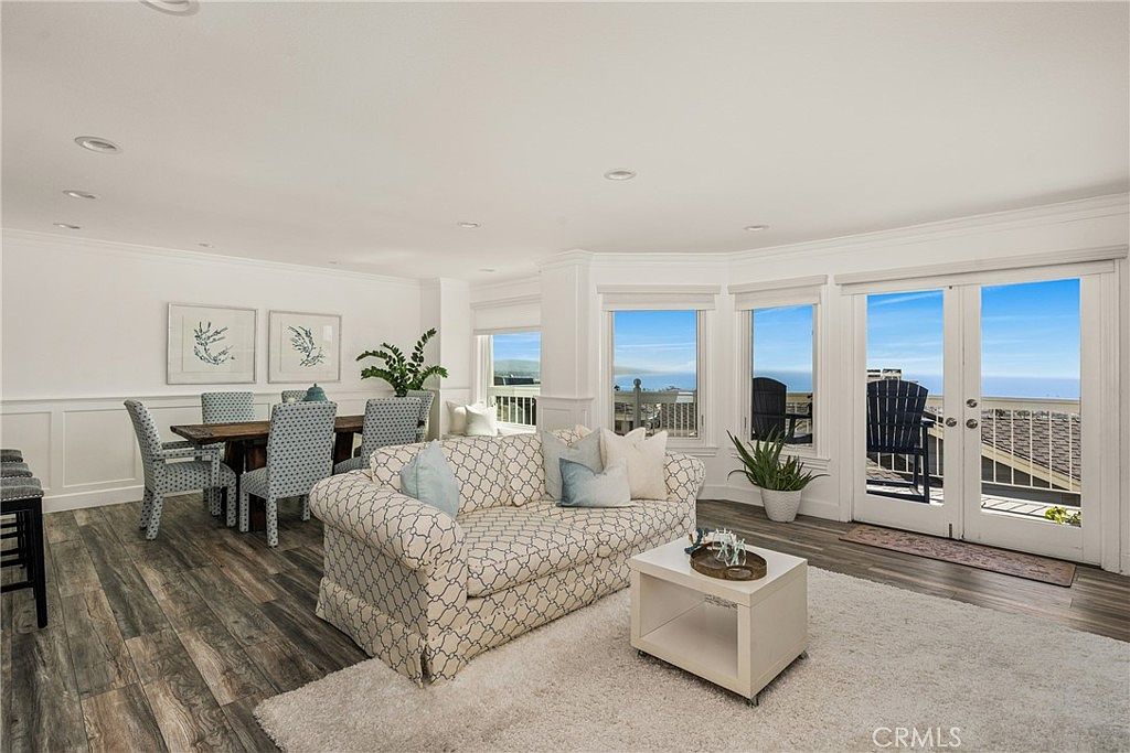 Primary suite with fireplace and balcony access.