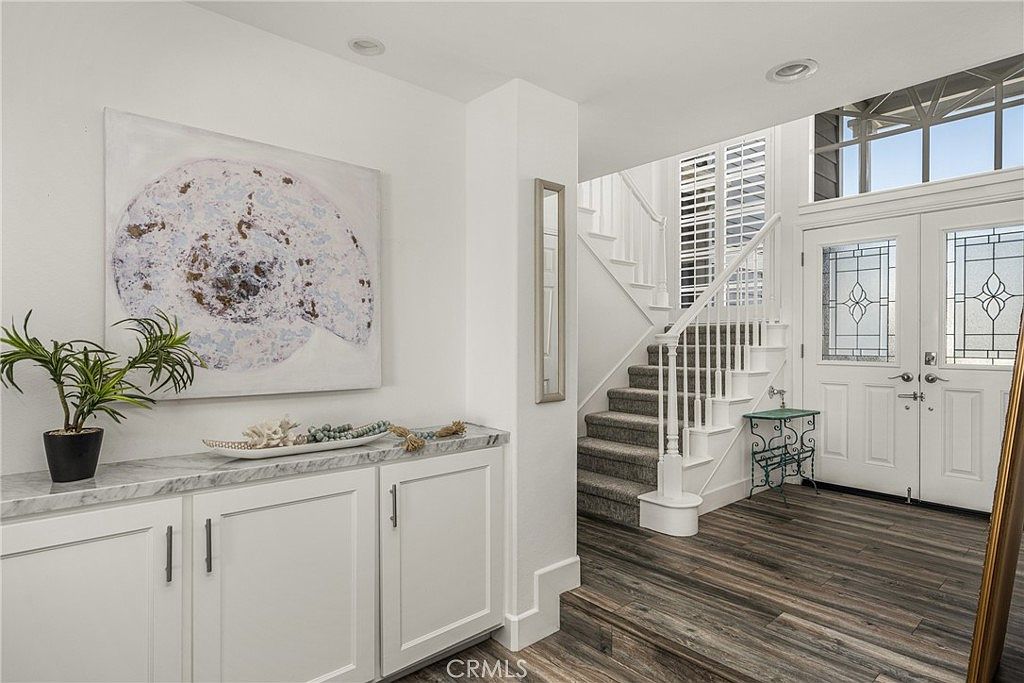 Spa-inspired primary bathroom with jetted tub and glass shower.