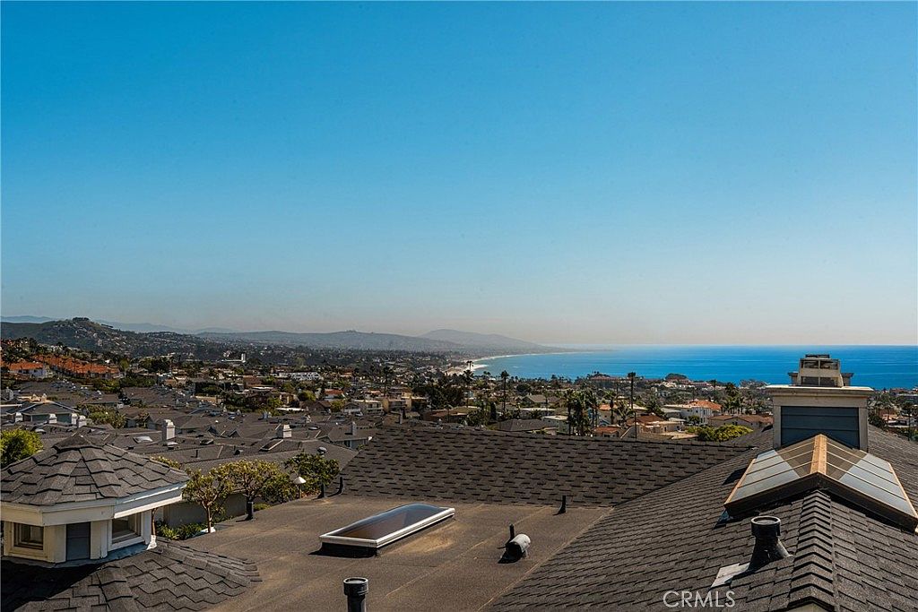 Panoramic white-water view of the Pacific Ocean and Dana Point coastline from 24444 Alta Vista Drive.
